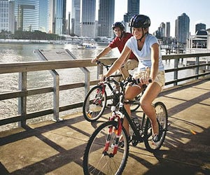 Cycling along the Brisbane River.